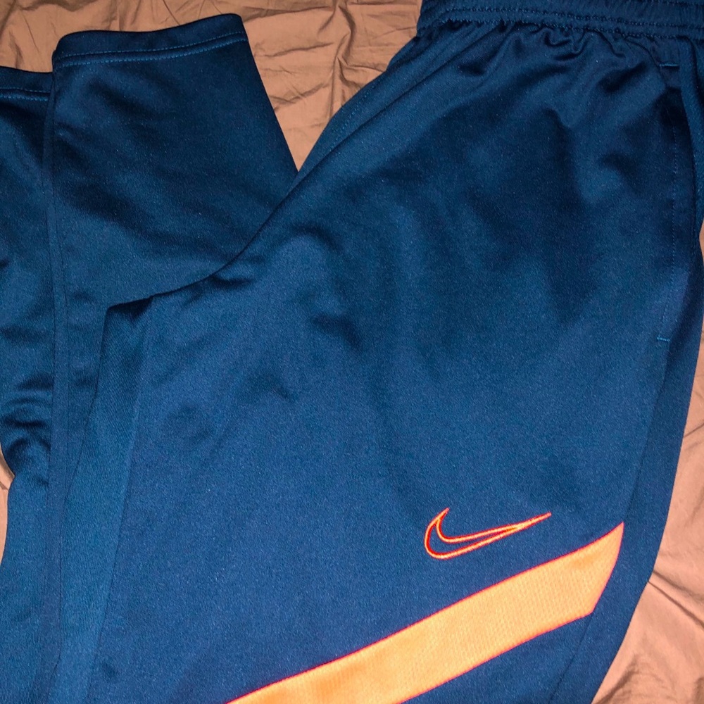 Nike track pants. DRI-FIT technology.